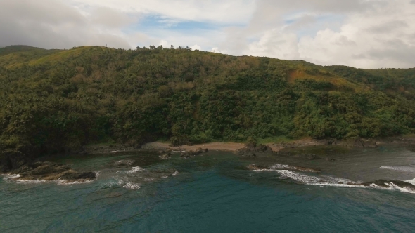 Seascape with Tropical Island, Beach, Rocks and Waves. Catanduanes, Philippines. alt