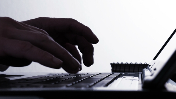 Hackers Hands Typing on Laptop Keyboard -