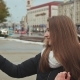 Young Beautiful Girl in Jacket Does Selfi Autumn in One of the City Streets. - VideoHive Item for Sale