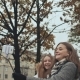 Two Young Girls Friends Do Selfi Autumn in One of the City Streets. - VideoHive Item for Sale