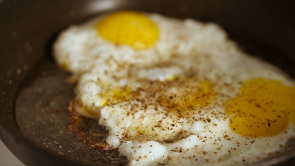 Preparing Scrambled Eggs on Hot Frying Pan