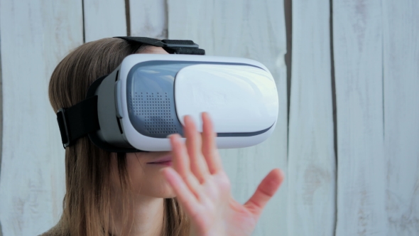 Young Woman Using Virtual Reality Glasses