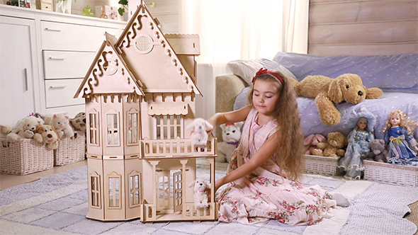 Girl Playing in a Toy House