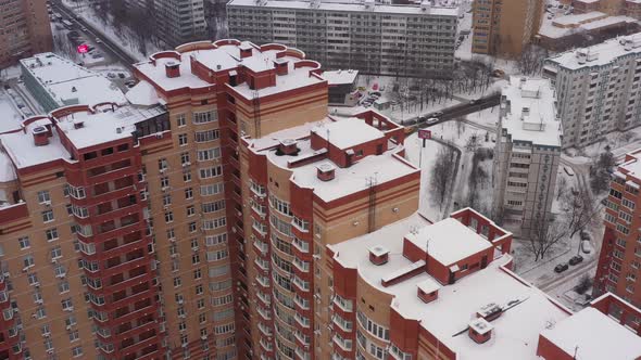 A Roundabout with a Monument to an Airplane in a Modern Area in Winter