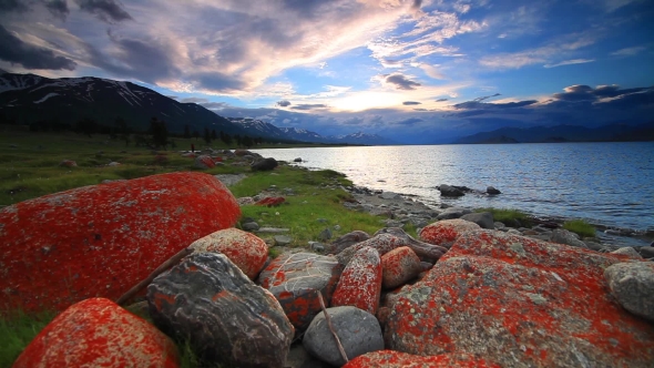 Sunset on the Rocky Shore of a Mountain Lake. Mongolia. Houghton Lake