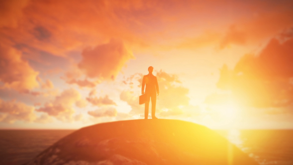 Young Businessman Standing On the Hill - Sunset alt