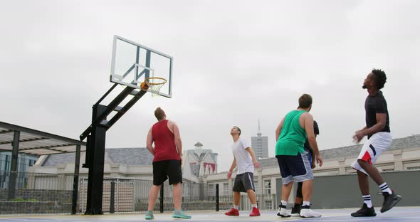 Basketball player throwing basketball in hoop 4k alt