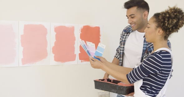 Young Couple Checking Paint Swatches alt