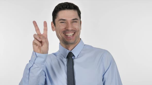 Excited Businessman Gesturing Victory Sign alt