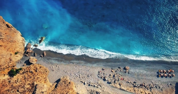 Blue Sea, Waves Breaking in Cliffs at Shore