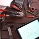 Mechanic Engineer Works with Tablet on His Desk - VideoHive Item for Sale