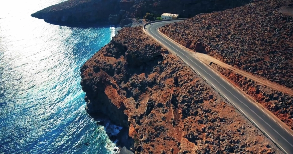 Flying Above Road By Seashore