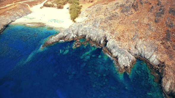 Blue Sea, Waves Breaking in Cliffs at Shore