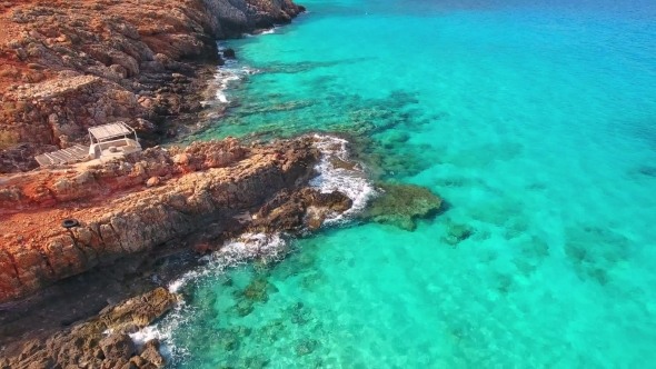 Blue Sea, Waves Breaking in Cliffs at Shore