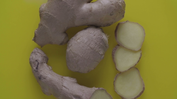 Ginger Root Rotating on a Yellow Background