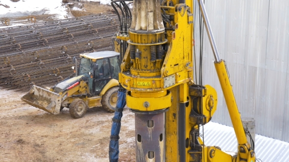 Drilling Equipment Makes a Hole for the Pole, at the Construction Site.