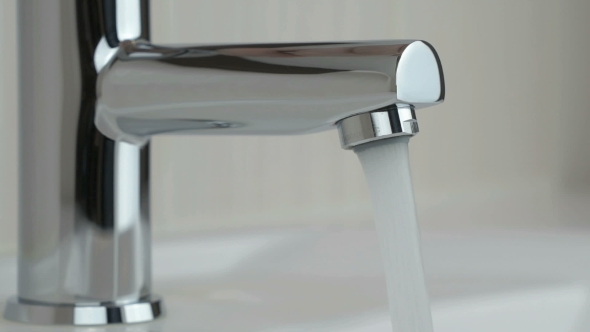 Water Under Strong Pressure Flows From a Water Tap