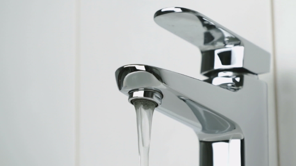Weak Flow of Water Pouring From Chrome Faucet
