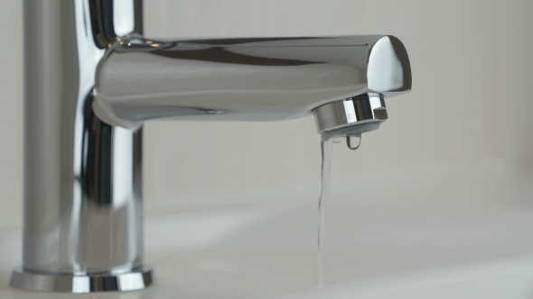 Water Dripping From Chrome-plated Faucet
