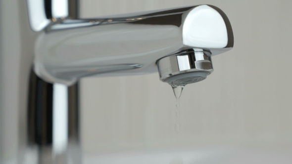 Water Dripping From Chrome-plated Faucet