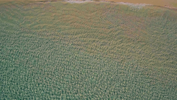 Aerial View Landing on Surface Ocean