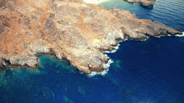 Blue Sea, Waves Breaking in Cliffs at Shore