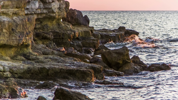 Waves Gently Splashing Against Rocks