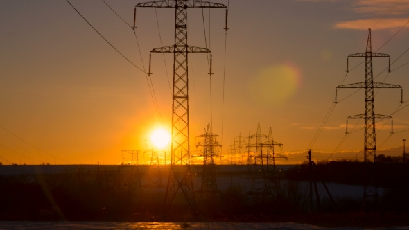 Sunset on a Background of a High-voltage Line alt
