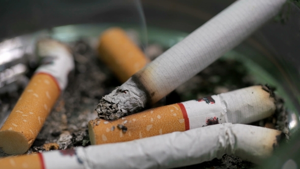 Man Puts a Cigarette in an Ashtray, Stock Footage | VideoHive