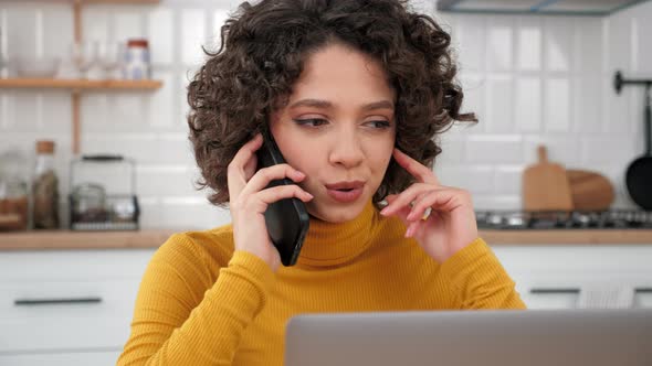 Close Up Smiling Curly Woman Student Talking on Mobile Phone at Home Kitchen