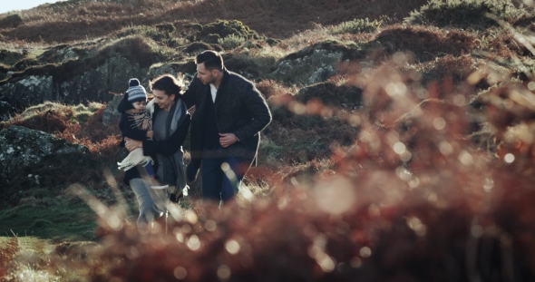 Happy Young Family with Enjoying Nature Together, Outdoors. Sunset. , High Speed Camera. . alt