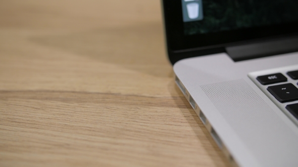 Male Hand Plugs in a Cable and Green Lamp Switches on