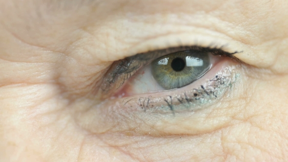 Adult Woman Blinking One Eye.