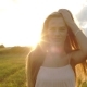 She Goes Through Hair on a Background of the Sun - VideoHive Item for Sale