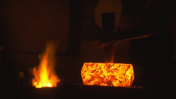 Blacksmith Forges Iron in the Forge