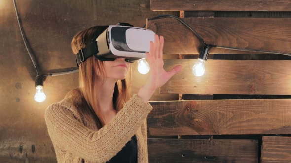Young Woman Using Virtual Reality Glasses