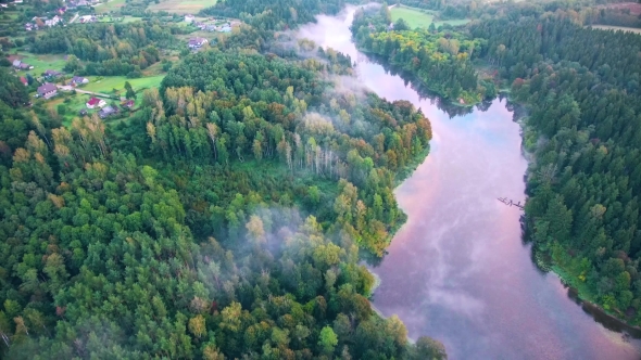 Flying Above Foggy Lake Early in the Morning