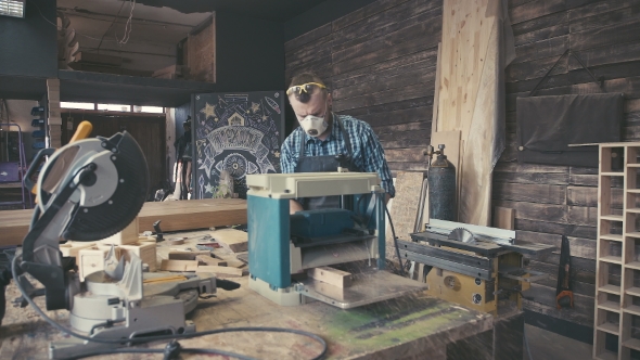 Craftsman with Saved Glasses Work at His Workstation.