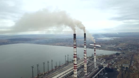 Aerial View of High Chimney Pipes with Grey Smoke From Coal Power Plant alt