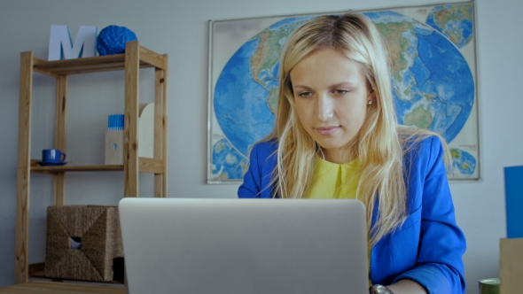 Female Creative Designer Working On Laptop