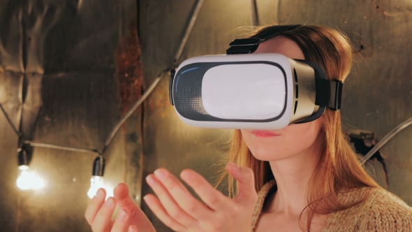 Young Woman Using Virtual Reality Glasses alt