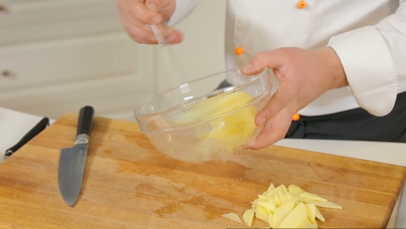 Chef Is Whisking Eggs in Glass Bowl alt