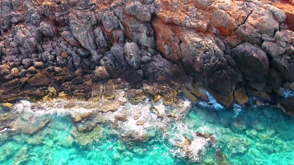 Blue Sea, Waves Breaking in Cliffs at Shore