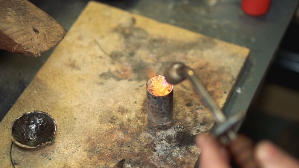 Master Performs the Heating Silver with a Soldering Iron in the Form Top View