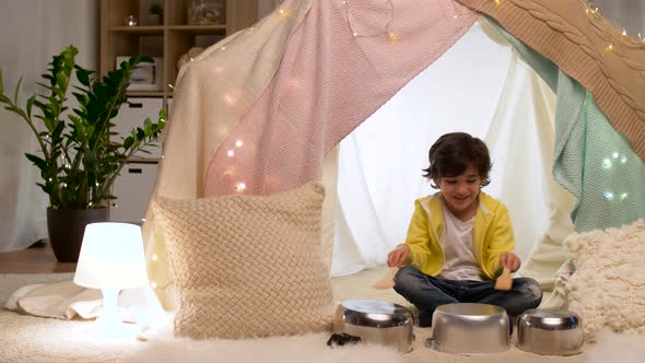 Boy with Pots Playing Music in Kids Tent at Home alt