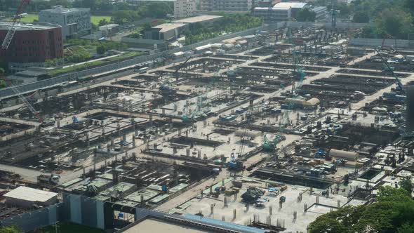 Time lapse of construction site with heavy construction machinery in metropolis alt