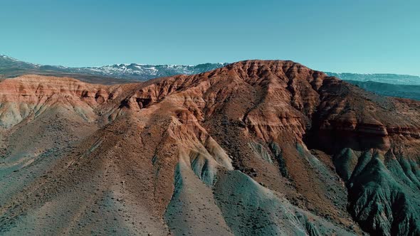 Flying Over Red Rock Formation alt