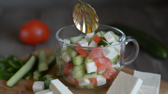 Salad with Vegetables and Cheese, Ingredients. Stir with a Spoon.