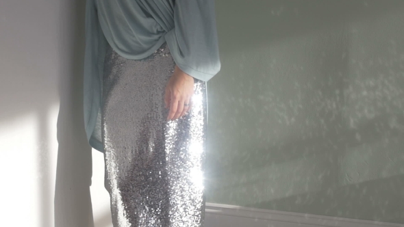 Woman in Glittering Skirt