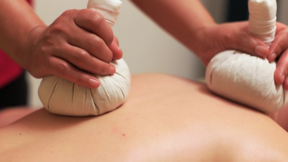 Detailed Look of Massage with Herbal Pouches